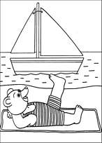 coloriage petit ours brun bronze a la plage